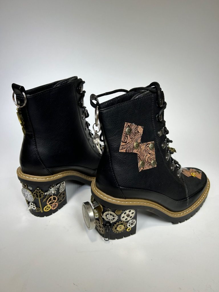 Steampunk Boots A pair of black hi top leather boots decorated with steampunk style accessories.